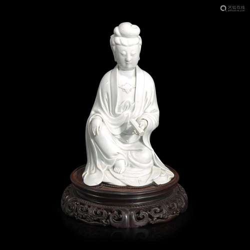 A Chinese blanc de Chine figure of Guanyin seated, with scro...