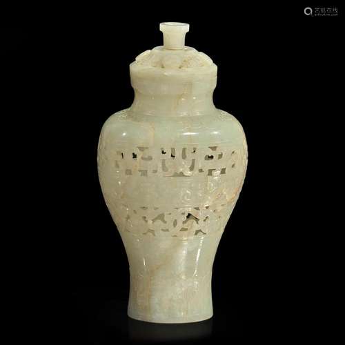 A Chinese carved pale celadon jade reticulated vase and cove...