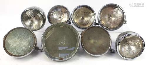 Eight vintage Joseph Lucas and other motor vehicle headlamps...