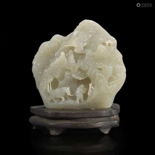 A small Chinese carved celadon-grey jade "mountain"...