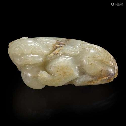 A Chinese carved pale celadon-grey and beige jade Buddhist l...