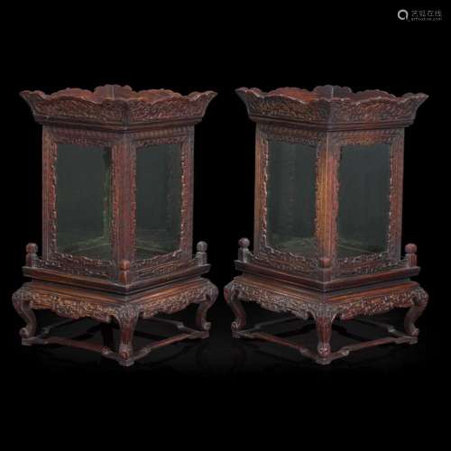 A pair of Chinese carved hardwood lanterns or small vitrines...