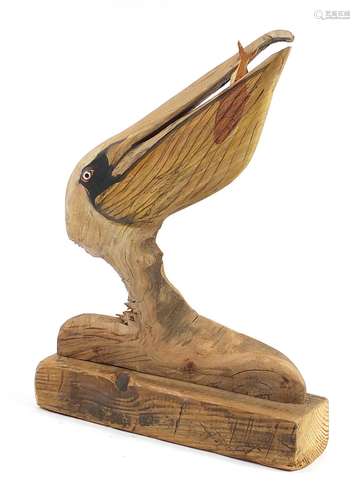 Clive Fredriksson 2021, driftwood carving of a stylised peli...