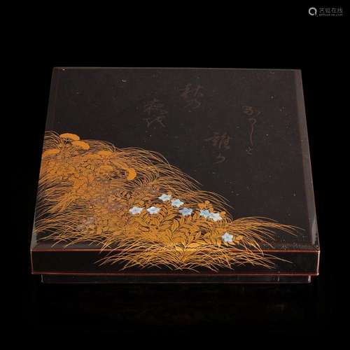 A Japanese lacquer writing box set with inlaid flowers and c...