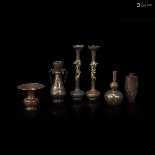 Four Japanese patinated bronze vases and a pair of candle st...