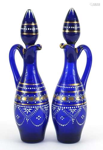 Pair of blue glass oil and vinegar bottles hand painted with...