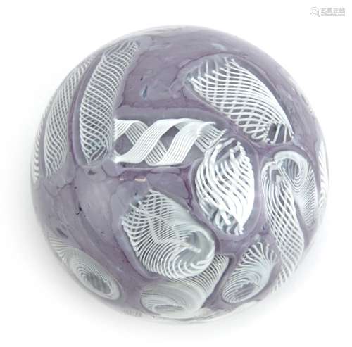 Latticino purple and white glass paperweight, 8cm in diamete...