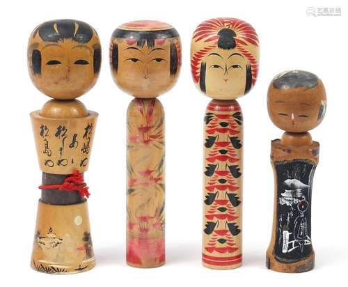 Four Japanese Kokeshi dolls, the largest 31cm high