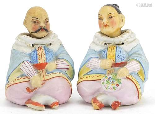 Pair of continental porcelain nodding figures of a Chinese m...