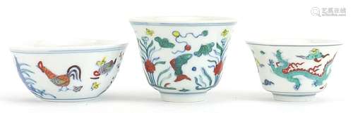 Three Chinese doucai porcelain tea bowls including one hand ...