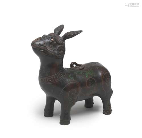 A VERY RARE GOLD AND SILVER-INLAID BRONZE TAPIR-SHAPED VESSE...