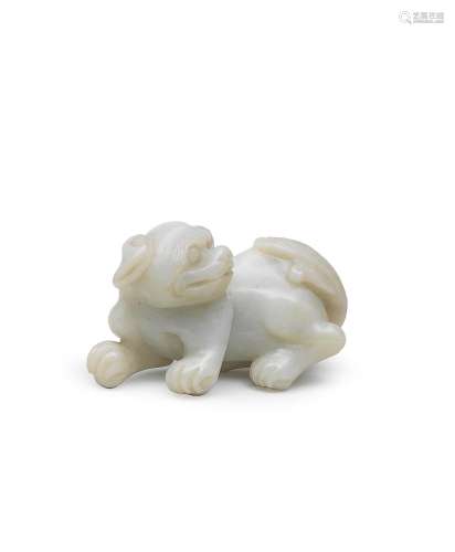 A PALE GREEN JADE CARVING OF A BUDDHIST LION  19th century