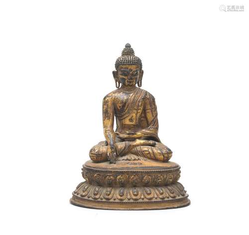 A GILT-BRONZE FIGURE OF BUDDHA SHAKYAMUNI Tibet, 14th/15th c...