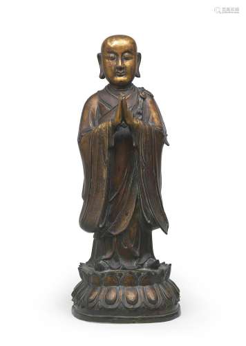 A VERY LARGE AND RARE GILT-BRONZE FIGURE OF ANANDA  Ming Dyn...