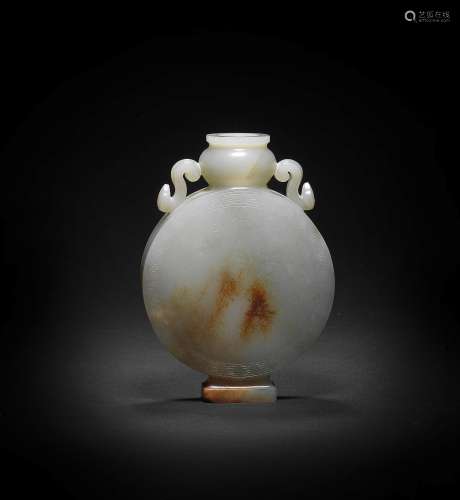 A RARE PALE GREEN AND RUSSET JADE IMPERIALLY-INSCRIBED '...