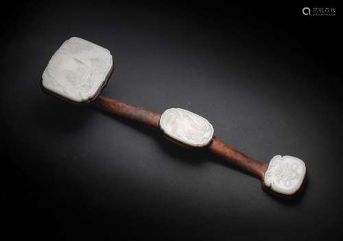 A SILVER-WIRE-INLAID AND JADE-INSET BOXWOOD RUYI SCEPTRE The...