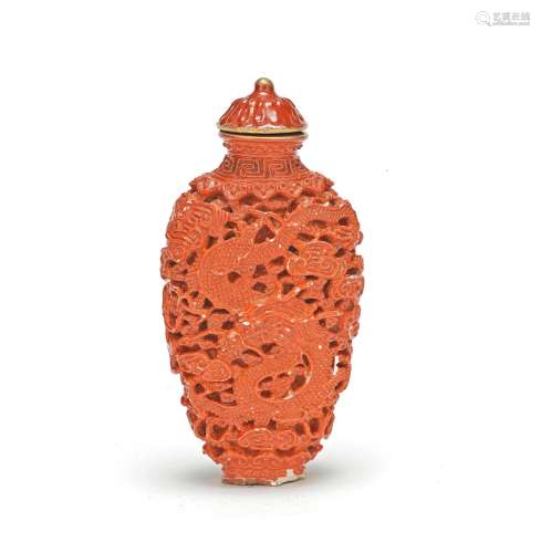 A CORAL RED PORCELAIN 'DRAGON AND PHOENIX' SNUFF BOTTLE