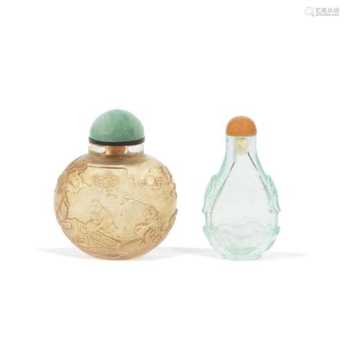 AN AQUAMARINE GLASS SNUFF BOTTLE AND A CARVED ROCK CRYSTAL B...
