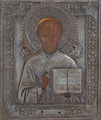 A RUSSIAN ICON OF ST. NICHOLAS WITH SILVER REPOUSSE OKLAD, 1...