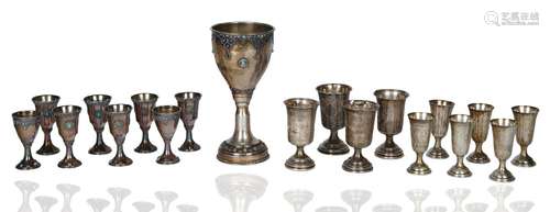 A SET OF SILVER KIDDUSH CUPS, SILVER AND SILVER-PLATED CUPS,...