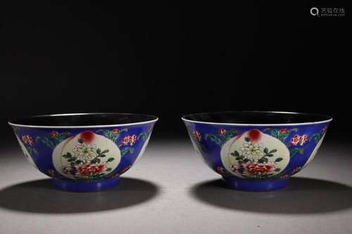 TWO CHINESE BLUE-GROUND FAMILLE-ROSE BOWLS DEPICTING 'FL...