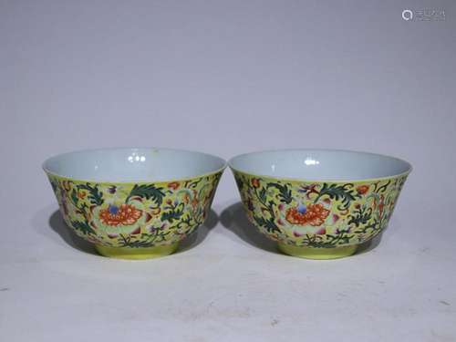 TWO CHINESE YELLOW-GROUND FAMILLE-ROSE BOWLS DEPICTING '...