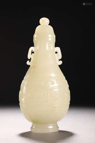 CHINESE HETIAN JADE HANDLED VASE WITH CARVED 'TAOTIE AND...