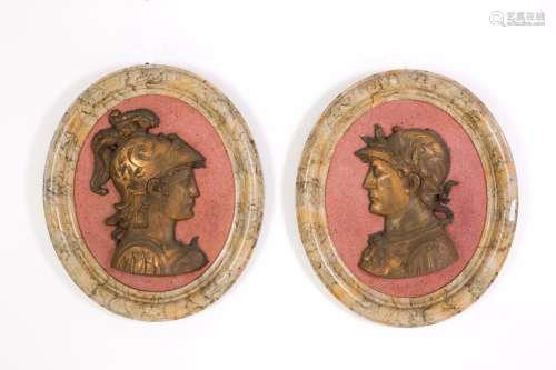Pair of oval medallions in gilded bronze