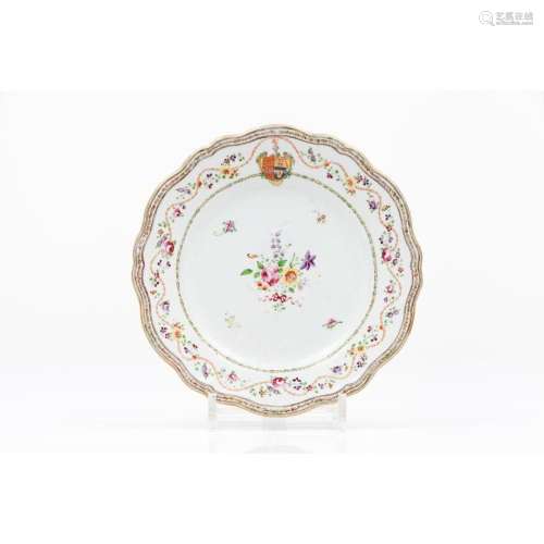 A scalloped armorial plate