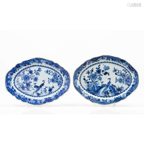 A pair of two oval and scalloped serving platters
