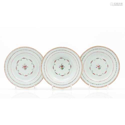 A set of three plates