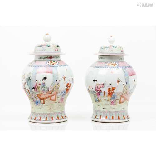 A pair of vases with covers