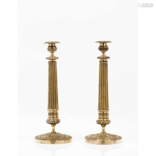 A pair of Louis XVI style candlestands