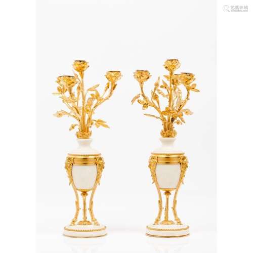 A pair of Louis XV style four branch candelabra