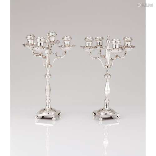 A pair of four branch candelabra