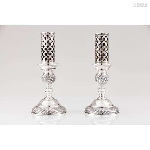 A pair of candle holders