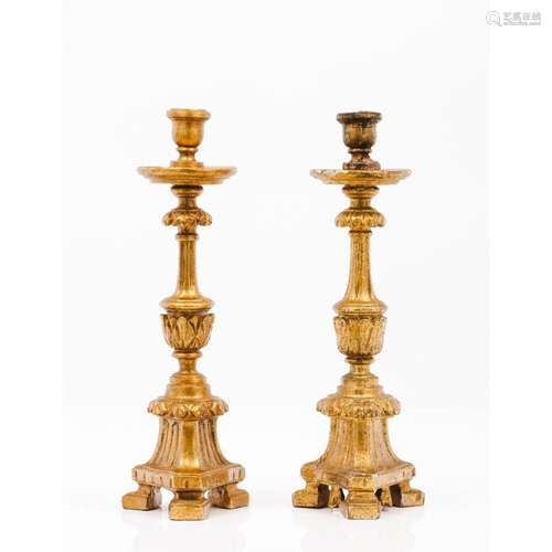 A pair of small candlestands