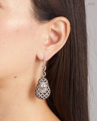 A PAIR OF WHITE TOPAZ AND DIAMOND EARRINGS