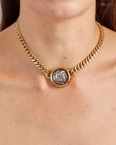 A COIN AND 18K GOLD NECKLACE