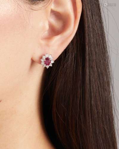 A PAIR OF RUBY AND DIAMOND STUDS