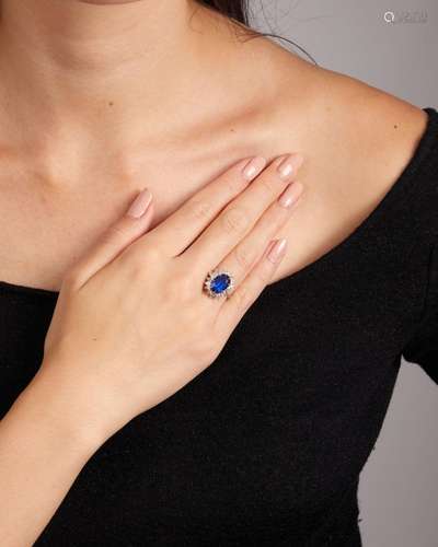 A SAPPHIRE AND DIAMOND RING