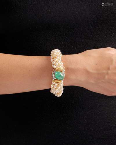 CARTIER A CULTURED PEARL, EMERALD, AND DIAMOND TORSADE BRACE...