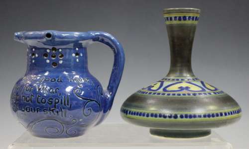 A Brannam pottery blue glazed puzzle jug, late 1