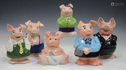 A family of six Wade NatWest pigs, including Cou