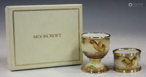 A Moorcroft enamel egg cup, height 5.8cm, and ma