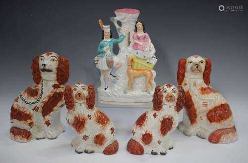 A pair of Staffordshire pottery spaniels, late 1