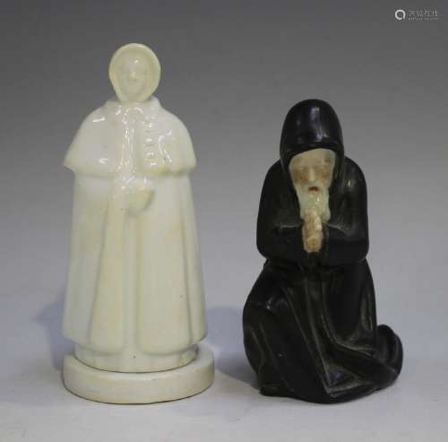 A Worcester porcelain kneeling Friar candle snuf