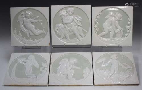 A set of six relief decorated cream glazed squar