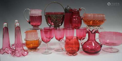 A small group of mostly cranberry coloured glass
