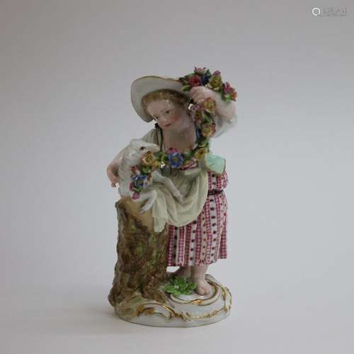 Statue en porcelaine multicolore d'une jeune fille avec mout...